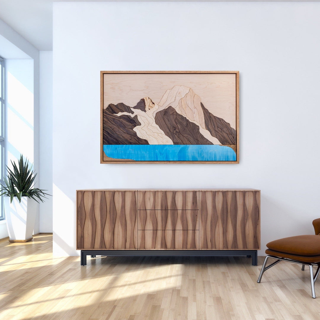 Large handmade wood artwork of Mount Robson and Berg Lake, showcasing nature-inspired craftsmanship in a luxurious home setting.