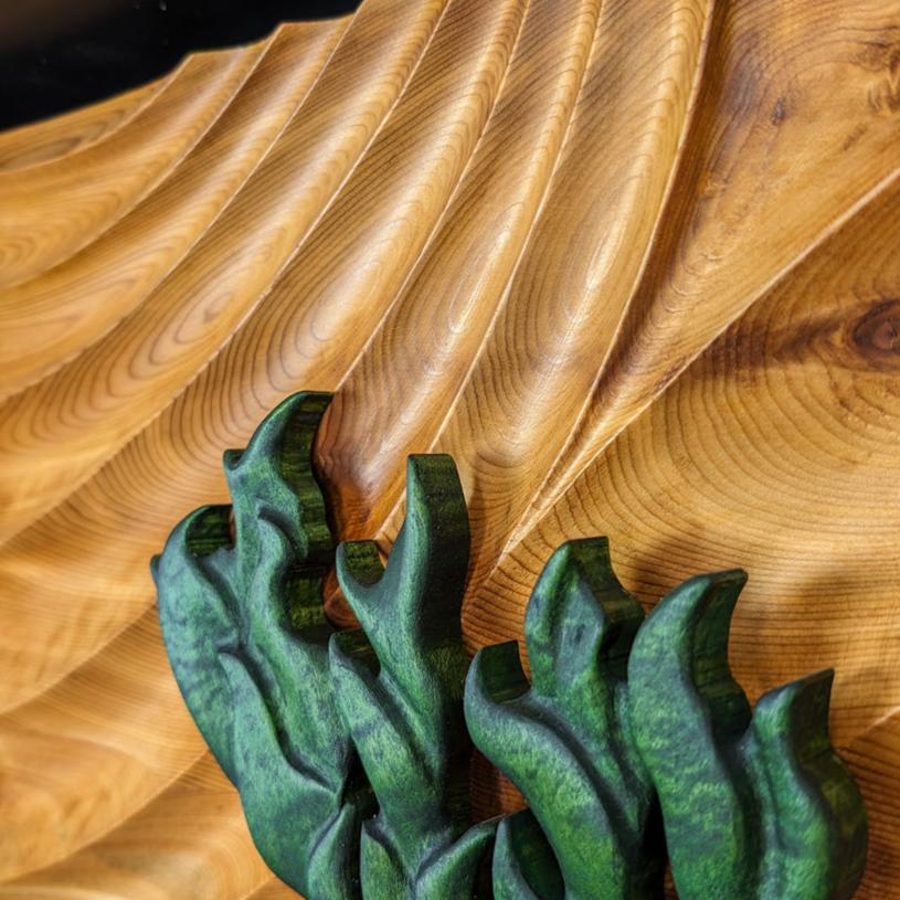 Fine wood carving details showcasing the craftsmanship of Alex Jepson, highlighting intricate texture and quality in The Windswept Pine sculpture.