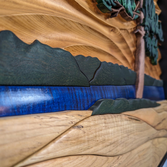 Detailed carving on The Windswept Pine sculpture by Alex Jepson, emphasizing the high-quality wood carving and texture.