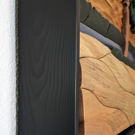 Close-up detail of The Windswept Pine wood sculpture by Alex Jepson, showcasing the intricate carving and natural textures of the tree.